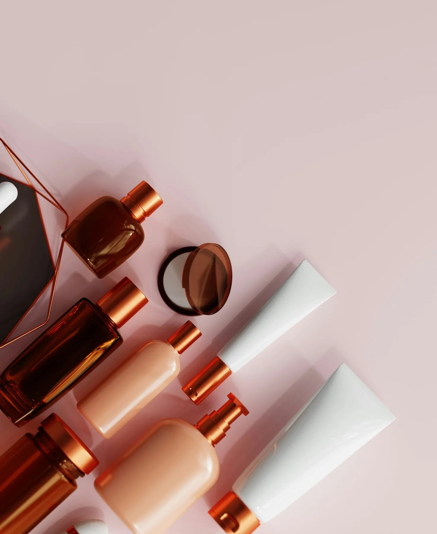 Premium cosmetic packaging arranged on a blush background