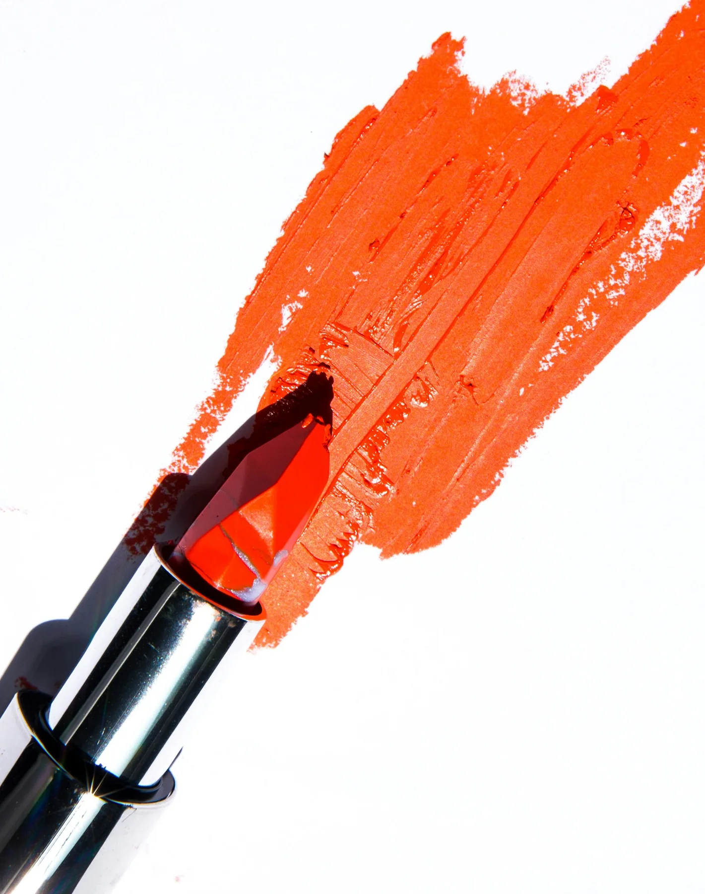 Orange lipstick swatch on a white background